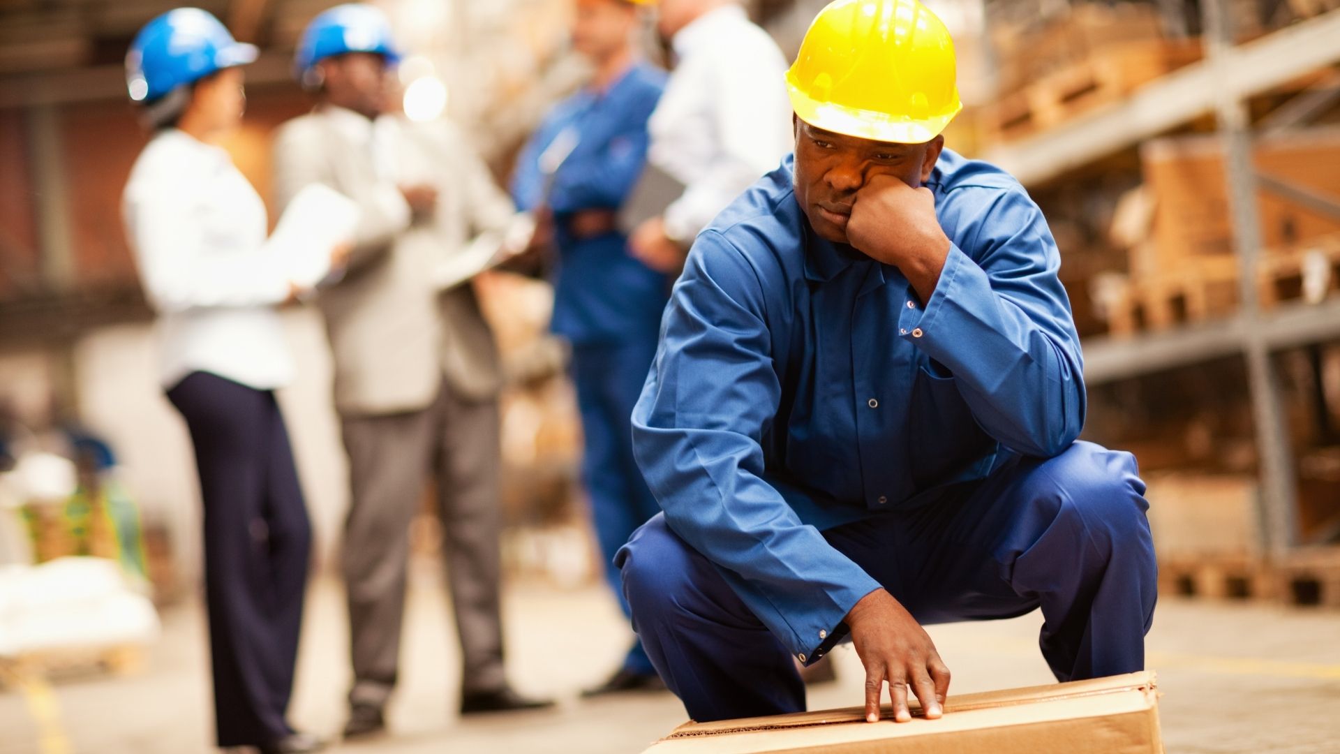 Tired warehouse worker